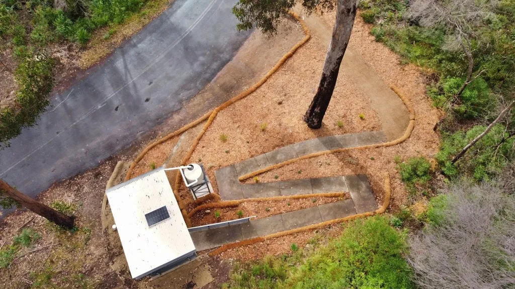 Top-down view of the Wonboyn toilet amenity at Myrtle Cove with the access path leading to the building.
