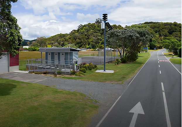 Matapōuri composting public toilet seen from the road—two standard cubicles and one accessible.